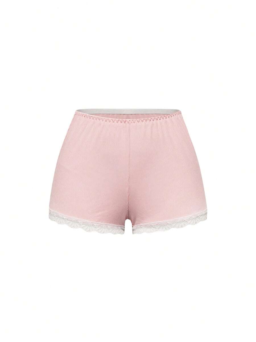 Ribbed lace camisole and shorts pajama set with spaghetti straps, bow detail, and contrast lace trim
