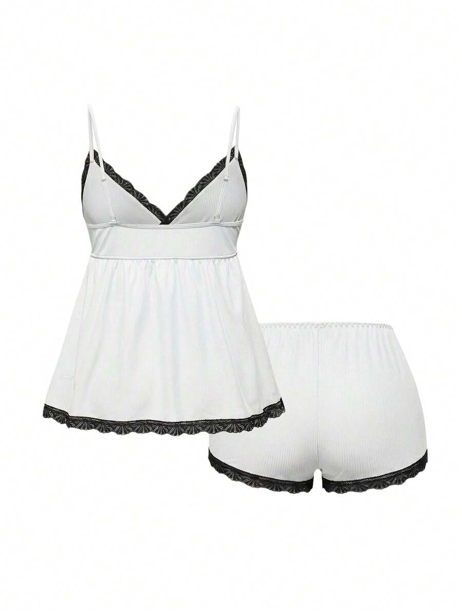 Ribbed lace camisole and shorts pajama set with spaghetti straps, bow detail, and contrast lace trim