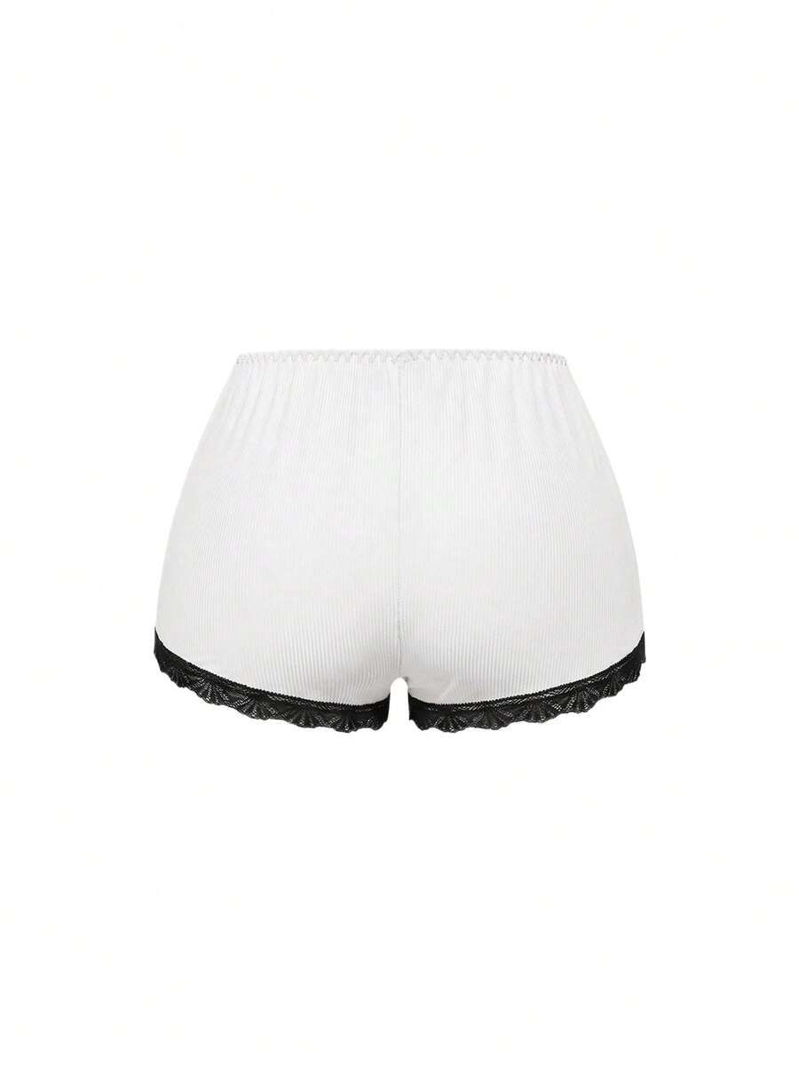 Ribbed lace camisole and shorts pajama set with spaghetti straps, bow detail, and contrast lace trim