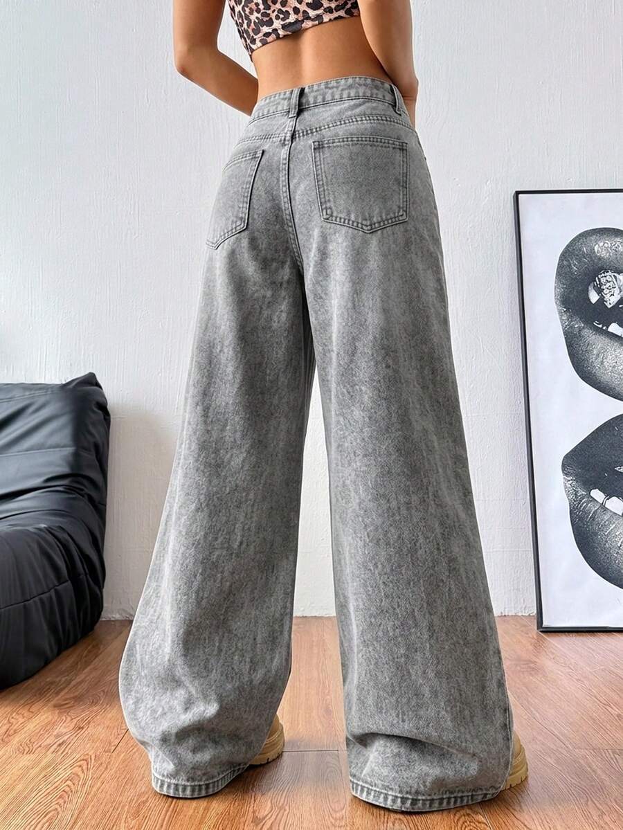 Women's relaxed fit wide leg denim jeans with pockets and a zipper fly.