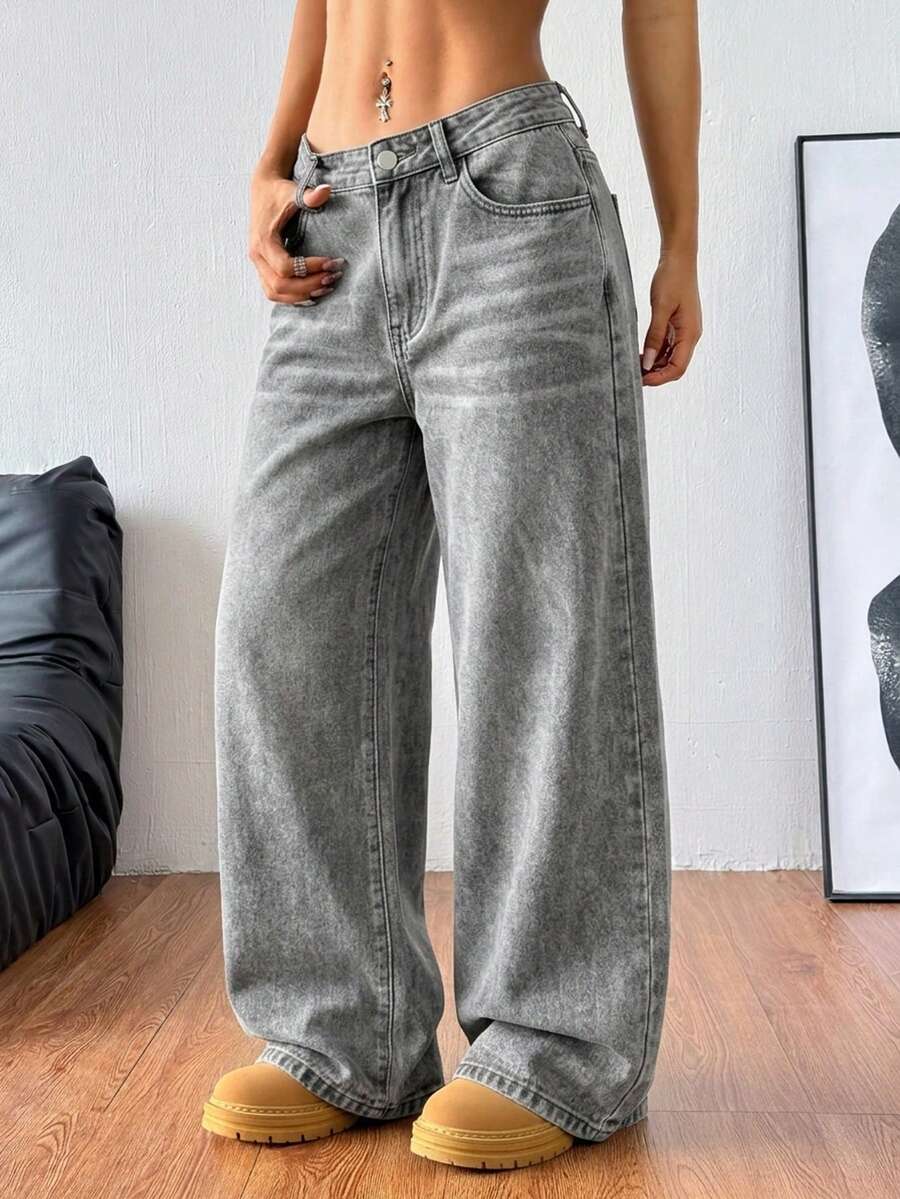 Women's relaxed fit wide leg denim jeans with pockets and a zipper fly.