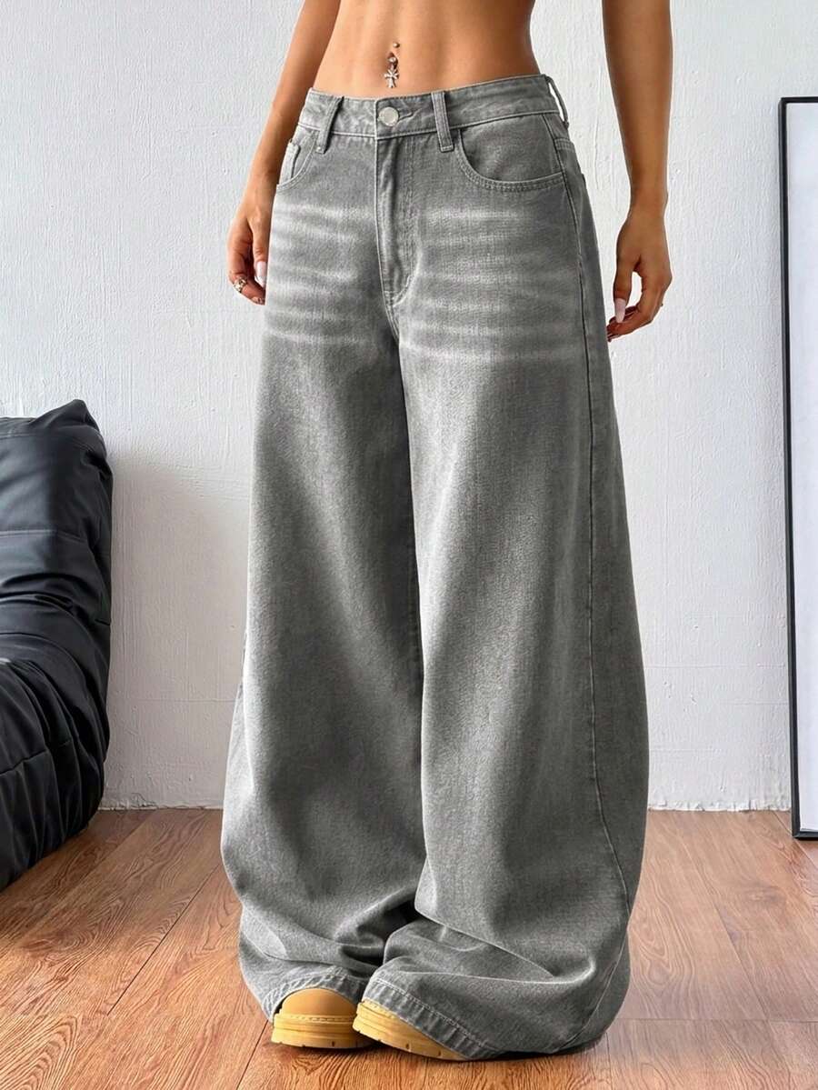 Women's relaxed fit wide leg denim jeans with pockets and a zipper fly.