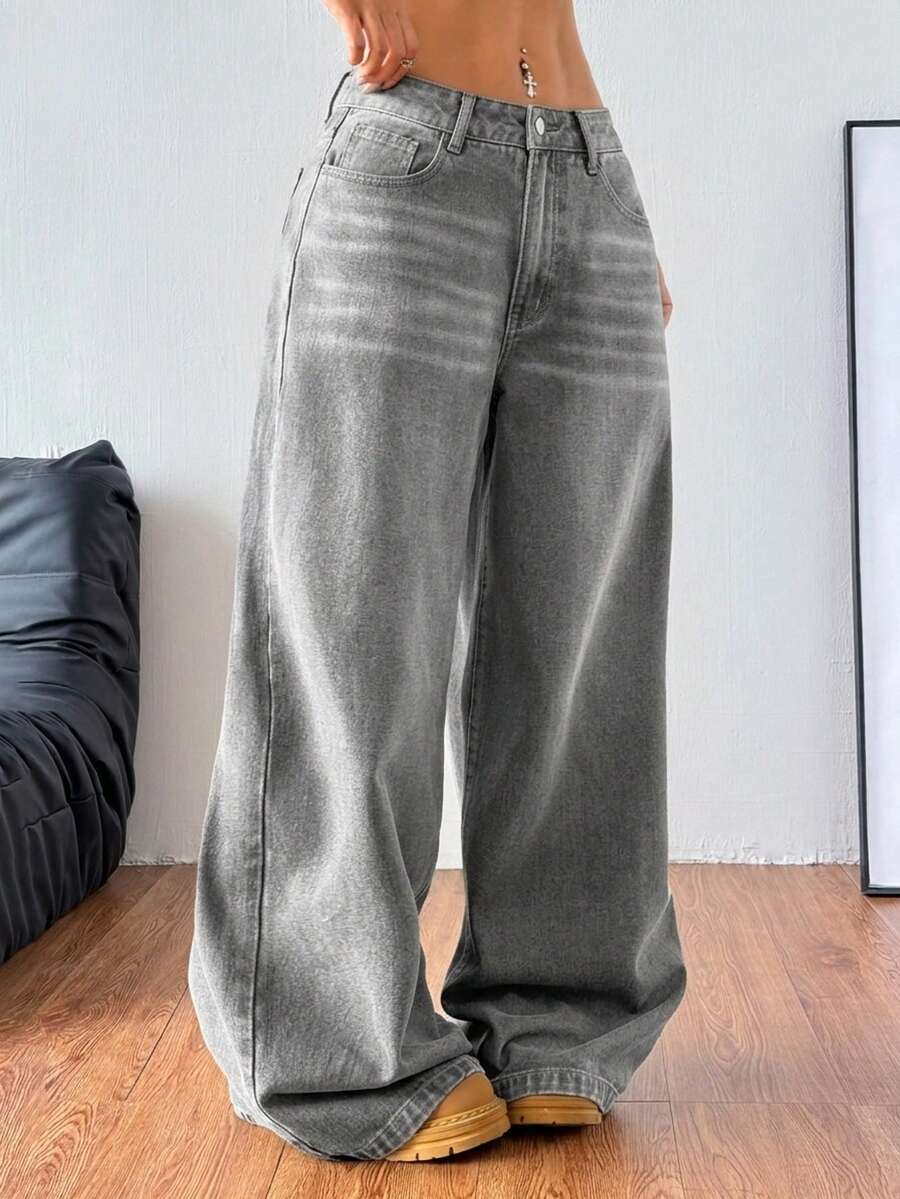 Women's relaxed fit wide leg denim jeans with pockets and a zipper fly.