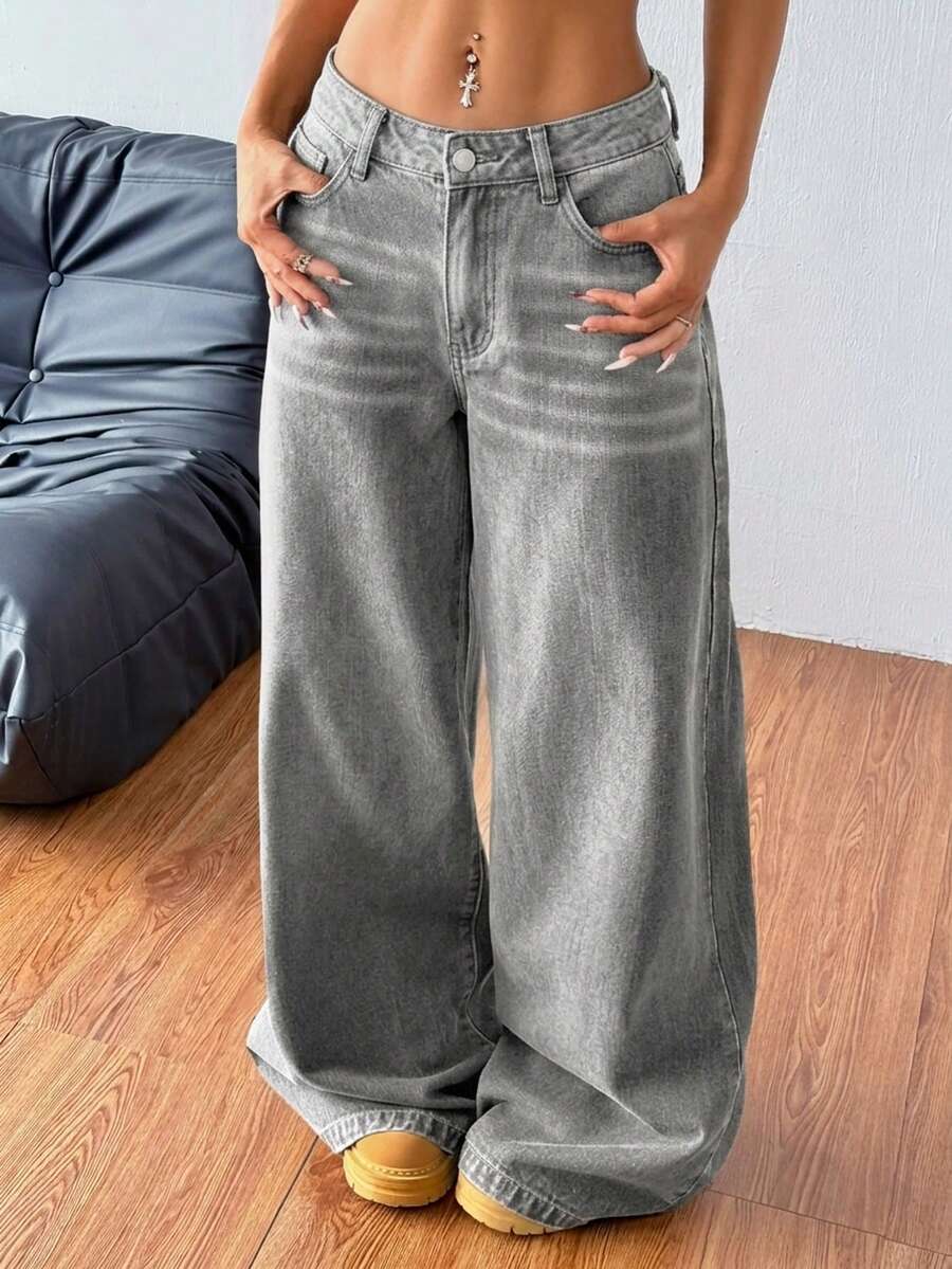 Women's relaxed fit wide leg denim jeans with pockets and a zipper fly.