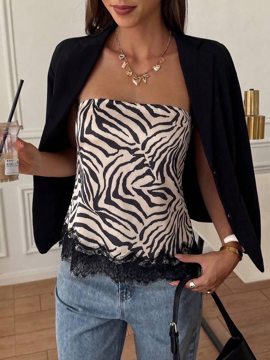 Strapless black and white bandeau top featuring a contrast lace patchwork flared hem and plant pattern.