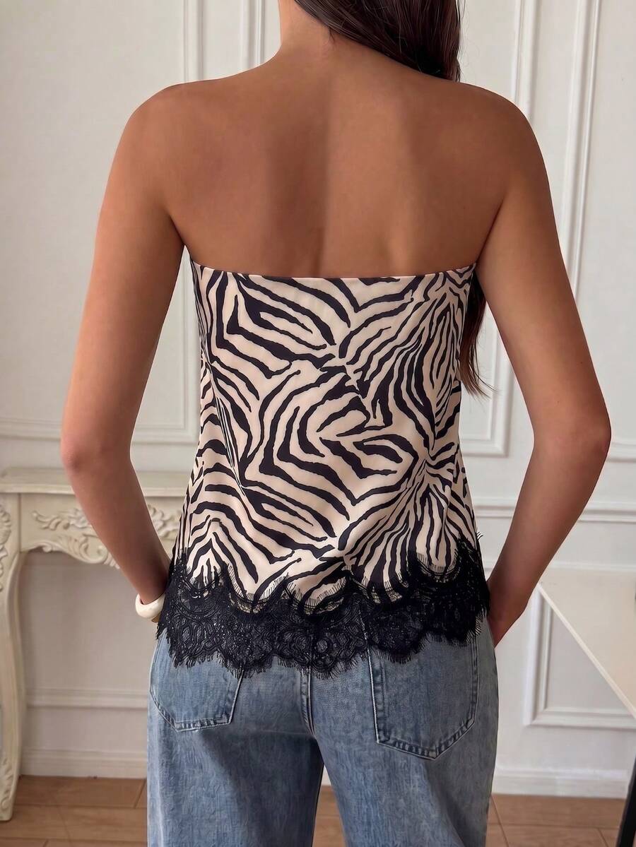 Strapless black and white bandeau top featuring a contrast lace patchwork flared hem and plant pattern.