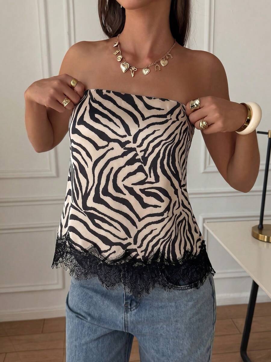 Strapless black and white bandeau top featuring a contrast lace patchwork flared hem and plant pattern.