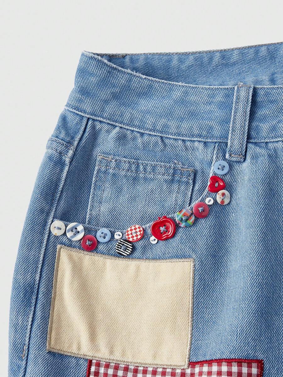 Women's loose baggy blue denim jeans featuring embroidered dragonfly and ladybug patch appliques, front pockets, and a straight-leg cut.