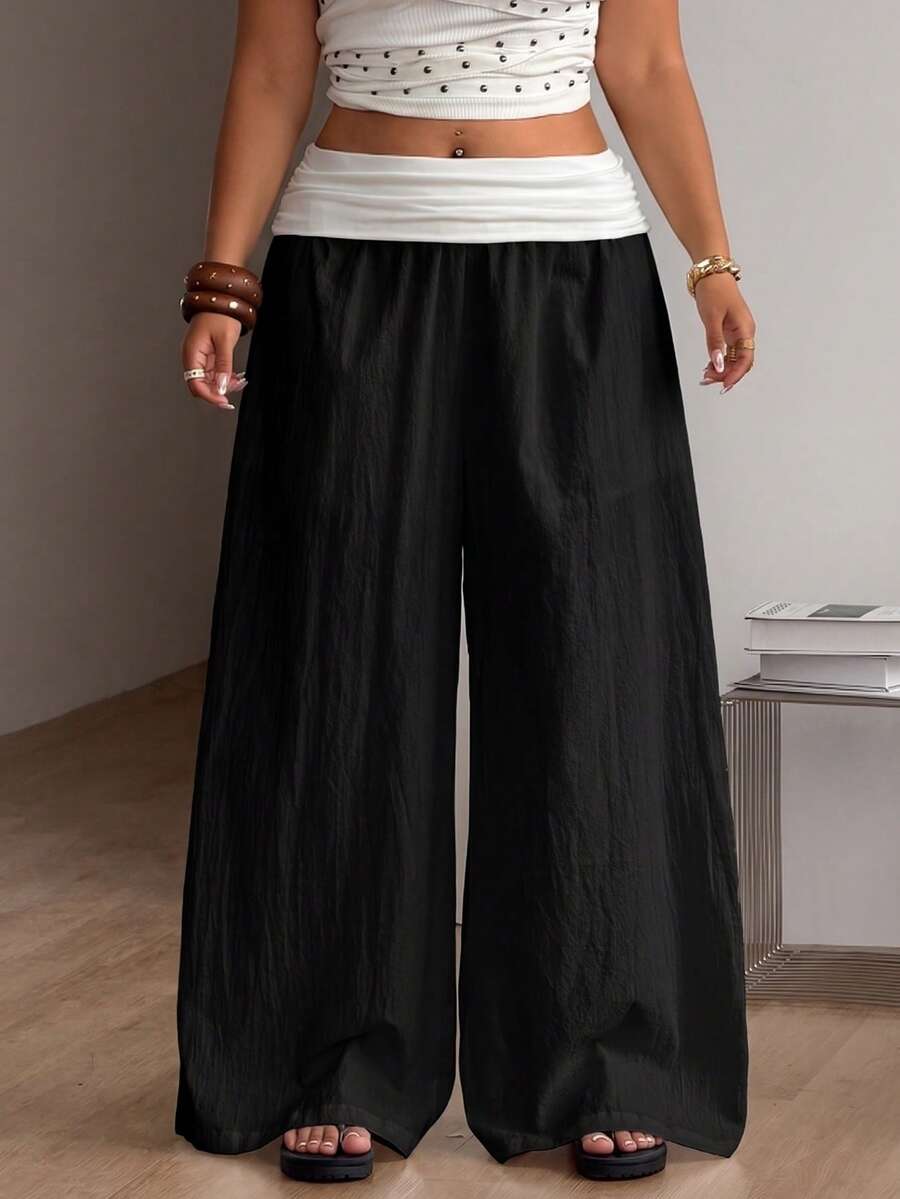 Women's plus size wide leg cotton pants featuring a relaxed loose fit and high waist design.