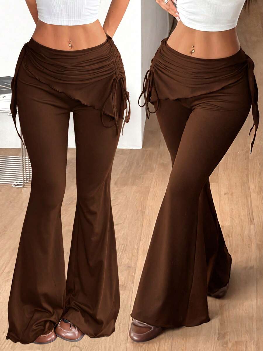 Women's black low rise flare pants with split hem detailing and stretchy knit fabric