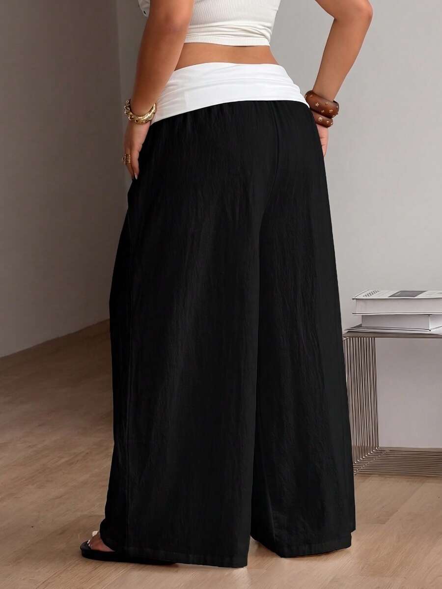 Women's plus size wide leg cotton pants featuring a relaxed loose fit and high waist design.
