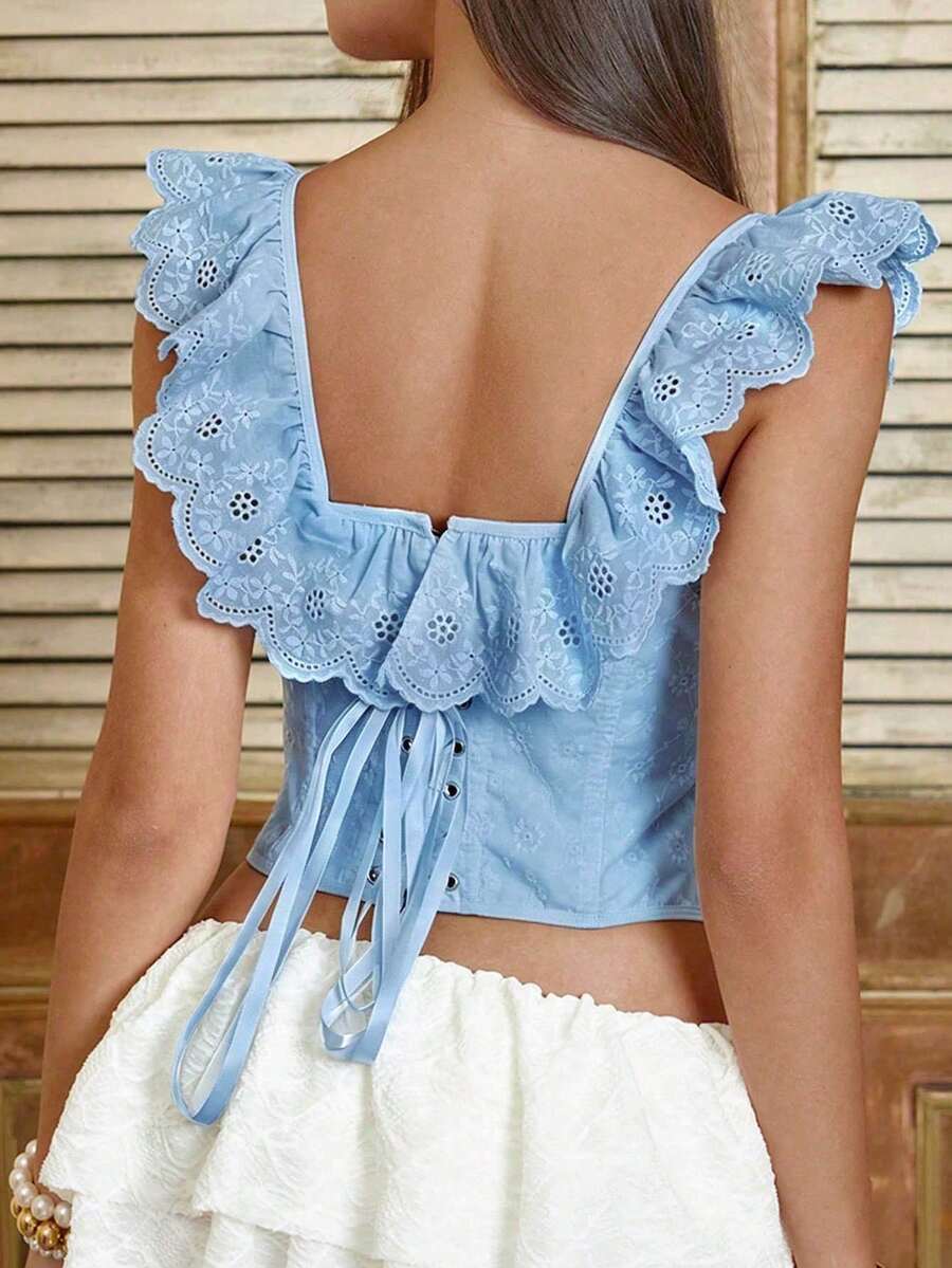 White sleeveless boned corset crop top featuring a square neckline and lace-up back detail.