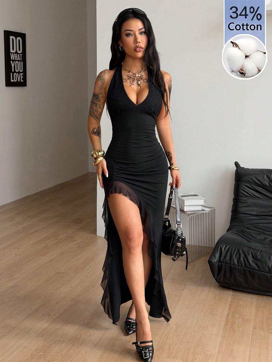 Women's slim fit black halter bodycon maxi dress featuring a sleeveless design and split thigh detail.
