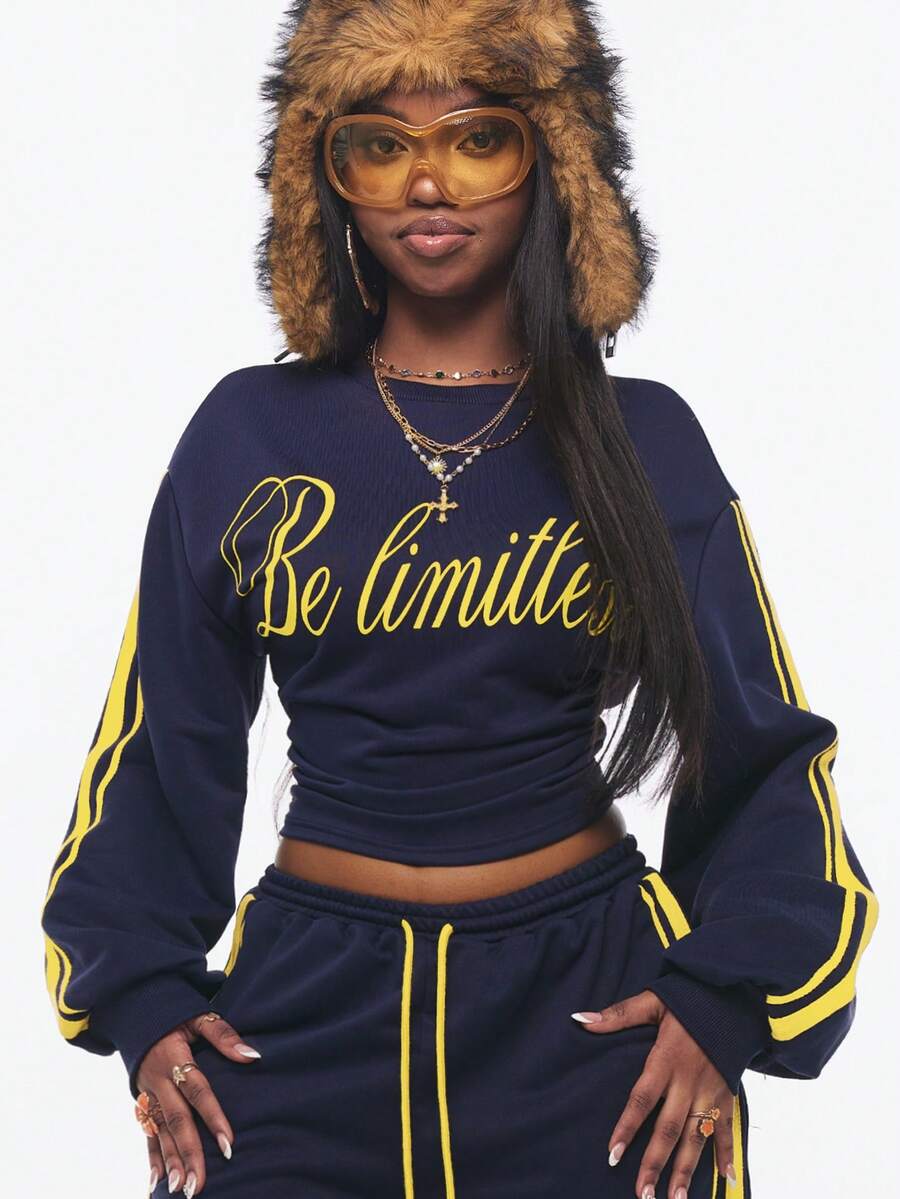 Women's casual black long sleeve knitted pullover sweatshirt featuring a round neck and cinched waist design.