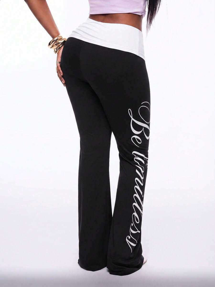 Women's black and white polka dot flare leg pants with side drawstring and ruched details