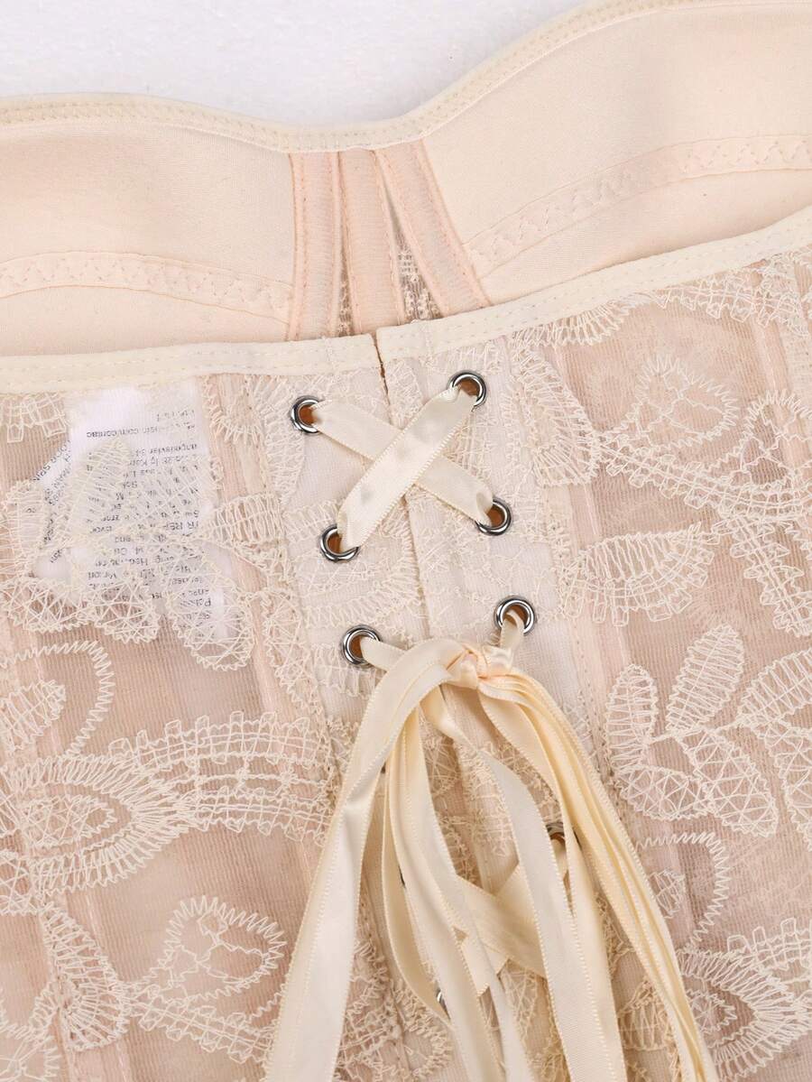 Women's strapless lace boned corset top featuring cup details, grommet eyelets, and a slim fit design.