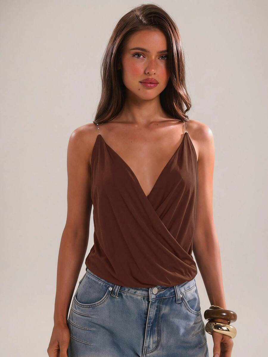 Women's black slim fit spaghetti strap camisole top with a plain design and wrap detail.