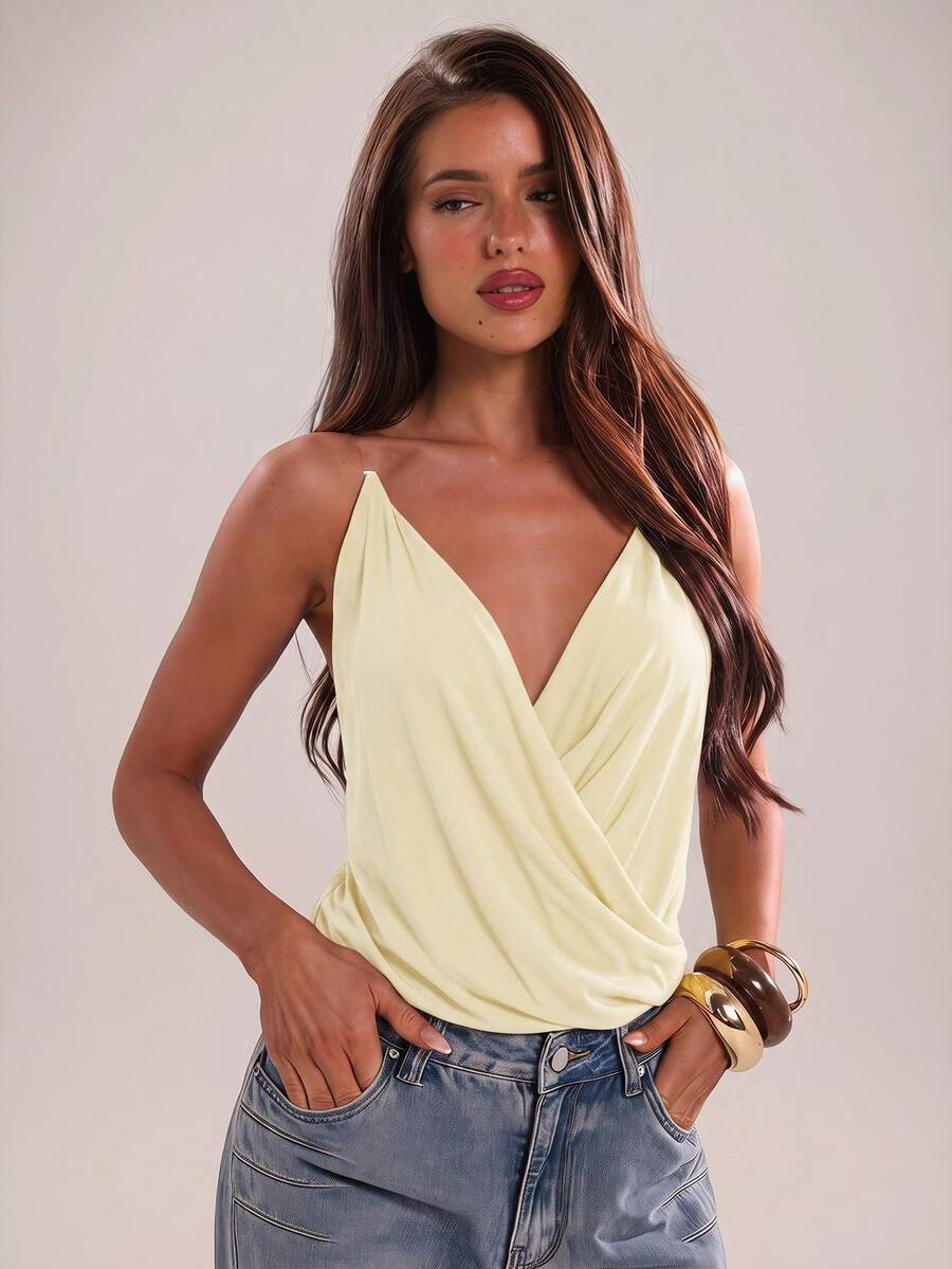 Women's black slim fit spaghetti strap camisole top with a plain design and wrap detail.