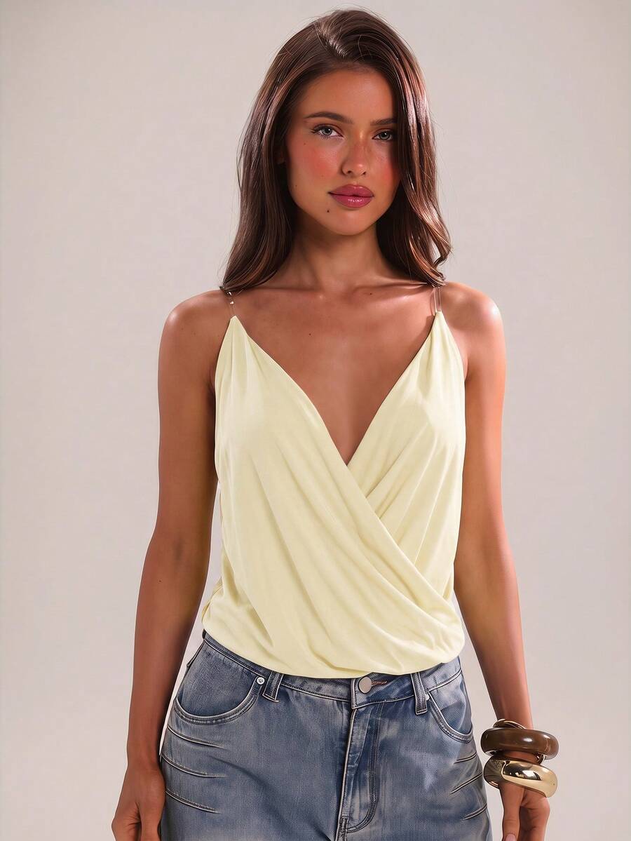 Women's black slim fit spaghetti strap camisole top with a plain design and wrap detail.