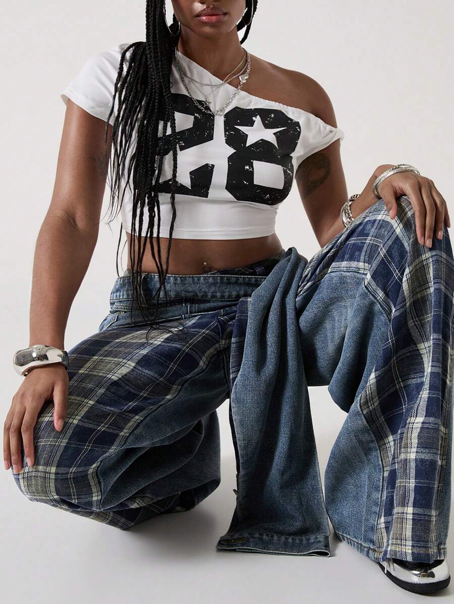 Women's plus size blue patchwork denim jeans featuring front lace-up detailing, mid waist, zipper fly, and functional pockets.