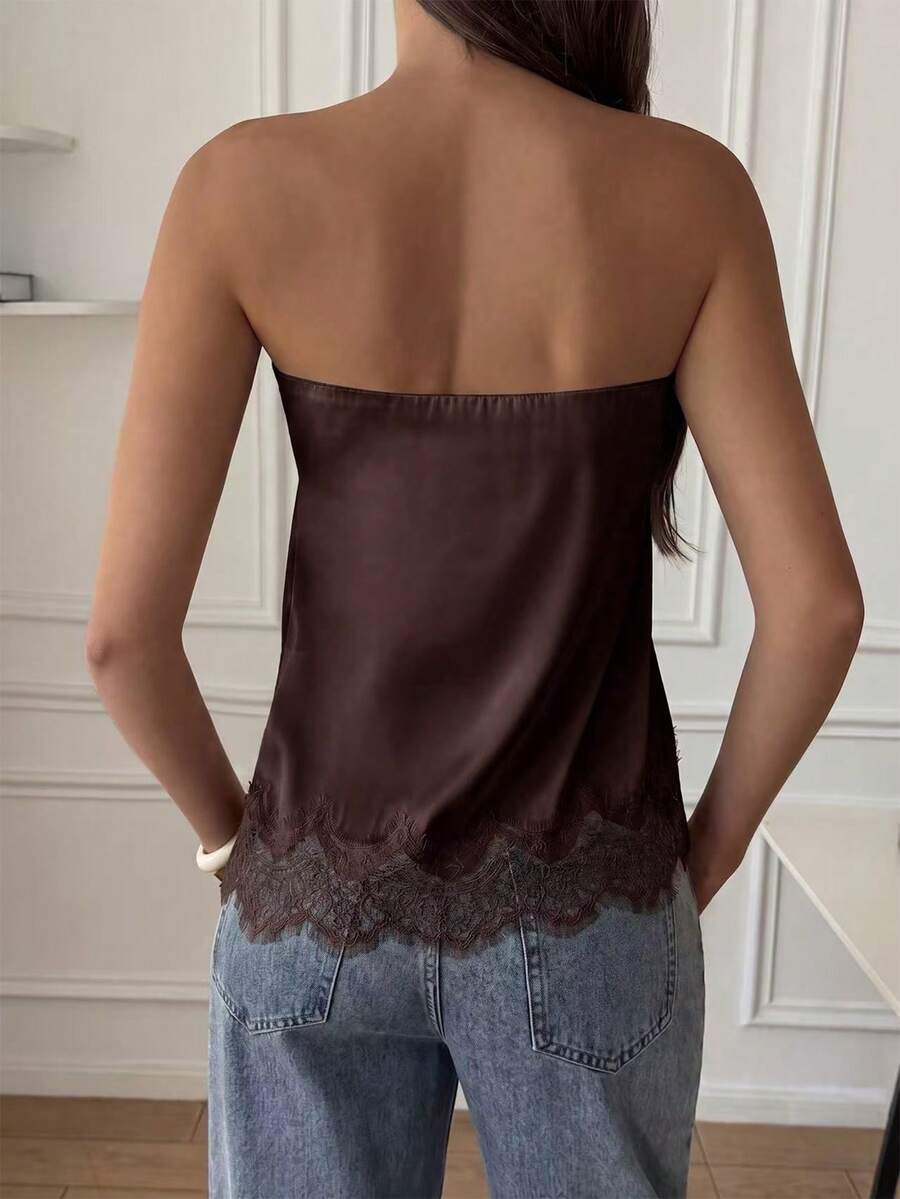 Strapless black and white bandeau top featuring a contrast lace patchwork flared hem and plant pattern.