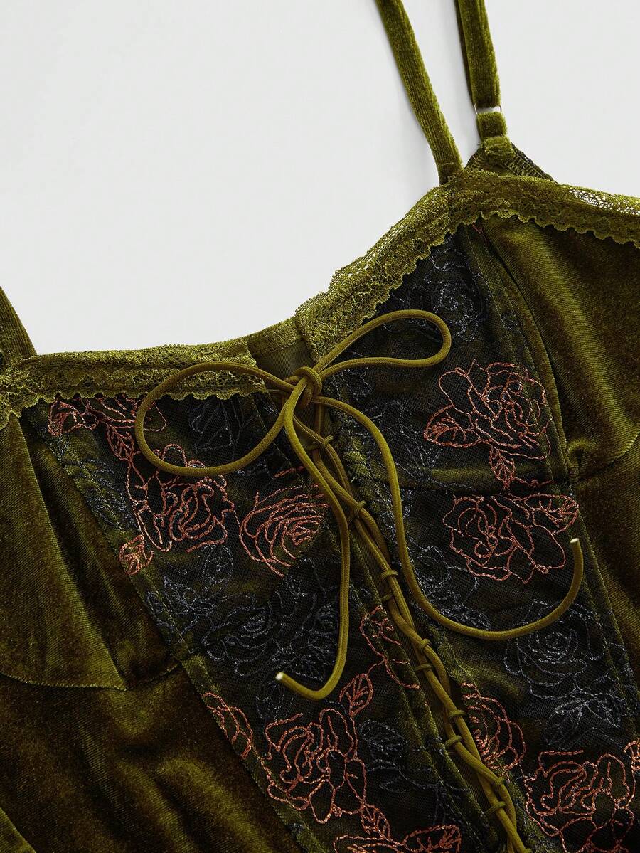 Green velvet crop top featuring lace-up front detailing, contrast lace cups, spaghetti straps, and detachable arm sleeves.