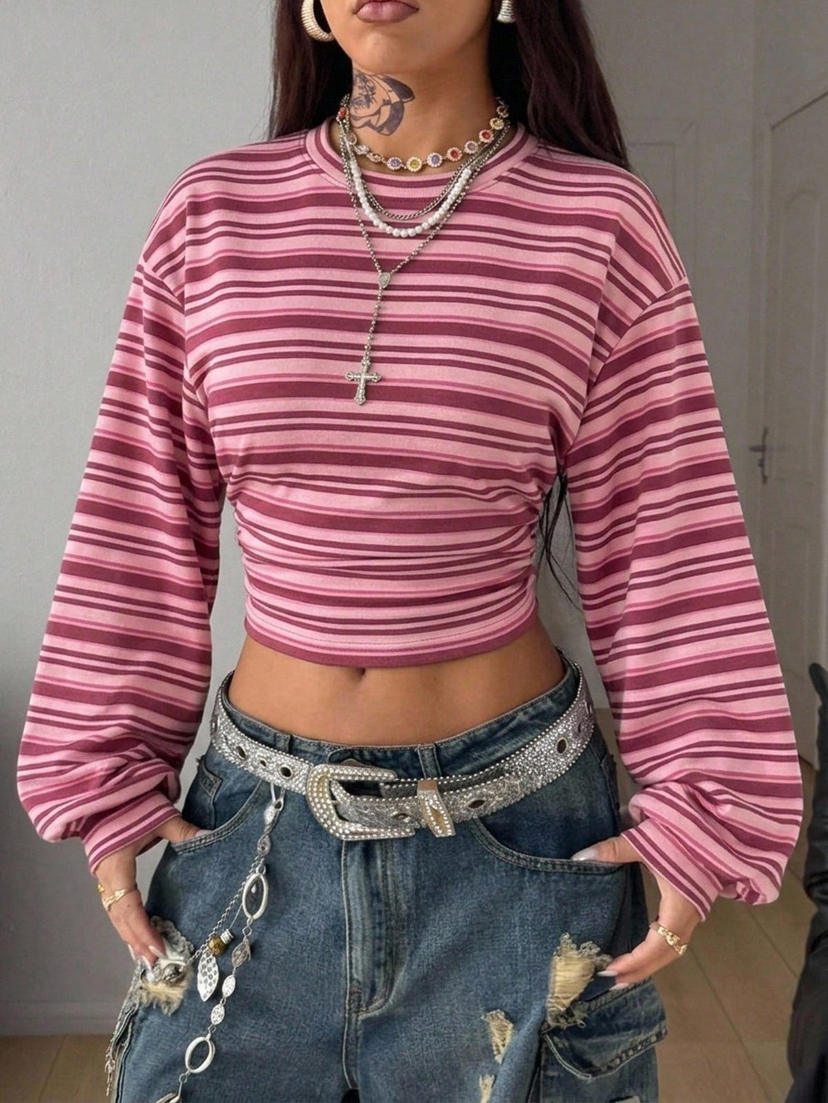 White striped long sleeve pullover sweatshirt for women featuring a round neck and drop shoulders.