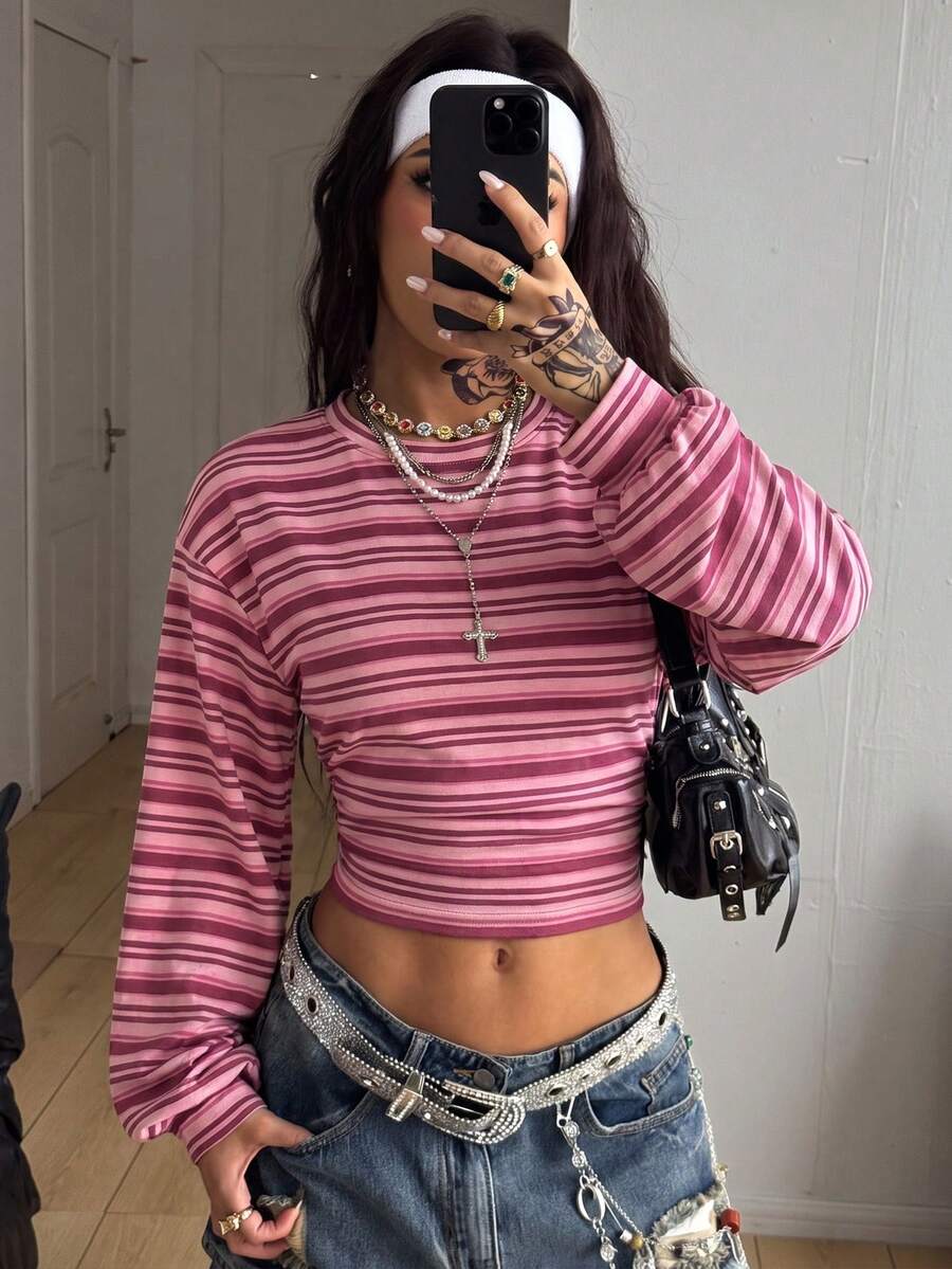 White striped long sleeve pullover sweatshirt for women featuring a round neck and drop shoulders.