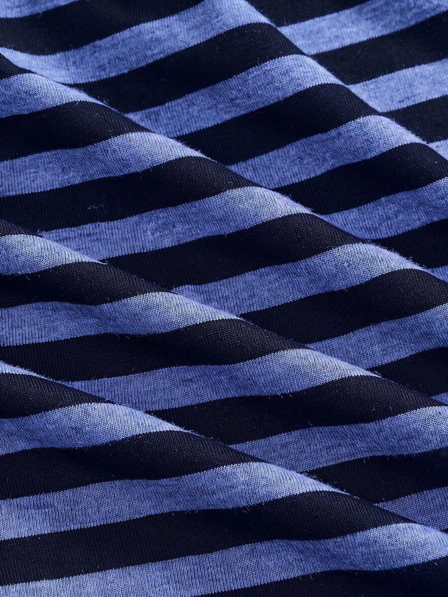 Women's striped strapless tube top featuring ruched detailing, flared hem, and stretchy knit fabric.