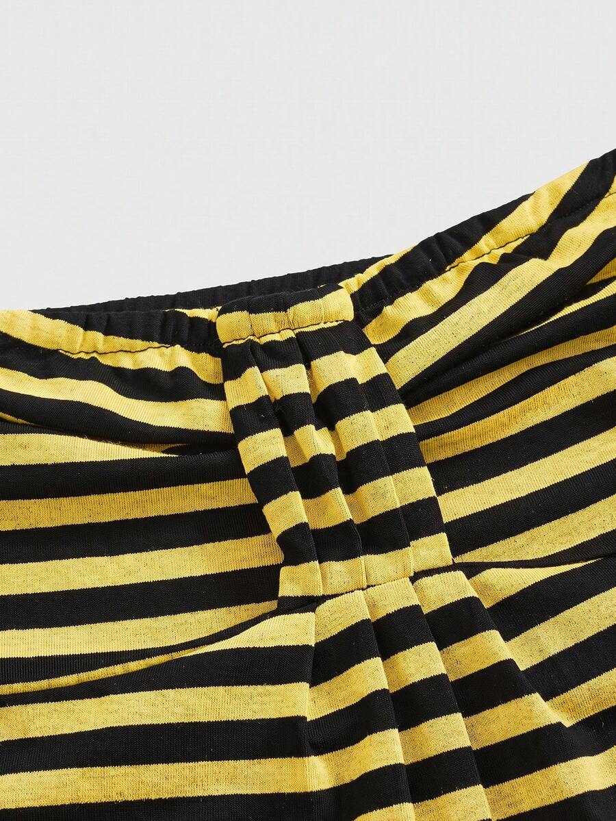 Women's striped strapless tube top featuring ruched detailing, flared hem, and stretchy knit fabric.
