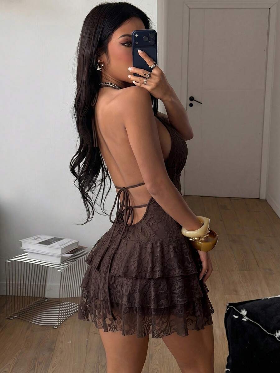 Front view of a women's lace halter mini dress featuring a slim-fit bodice, flared hem, and sleeveless design.