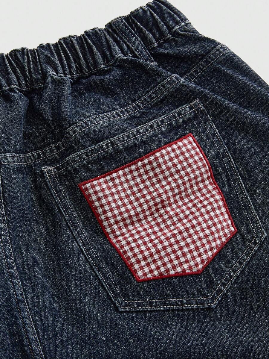 Women's plus size loose straight leg dark wash denim jeans with plaid apple patch embroidery and pockets.