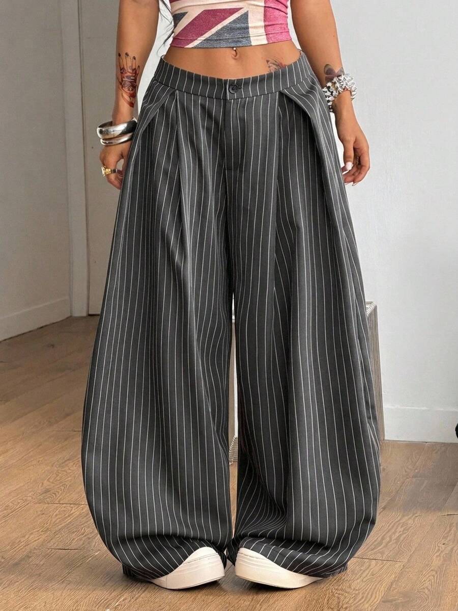 Women's loose fit dark grey harem pants featuring an elastic low waist, side pockets, and a wide leg casual streetwear cut.