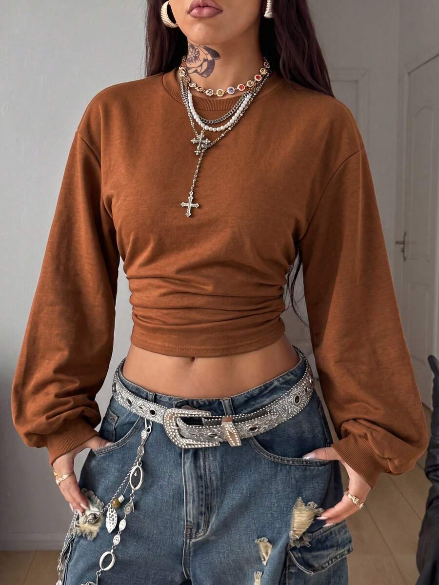 Women's brown waist-cinching sweatshirt featuring a round neck, drop shoulder long sleeves, and rib-knit cuffs.