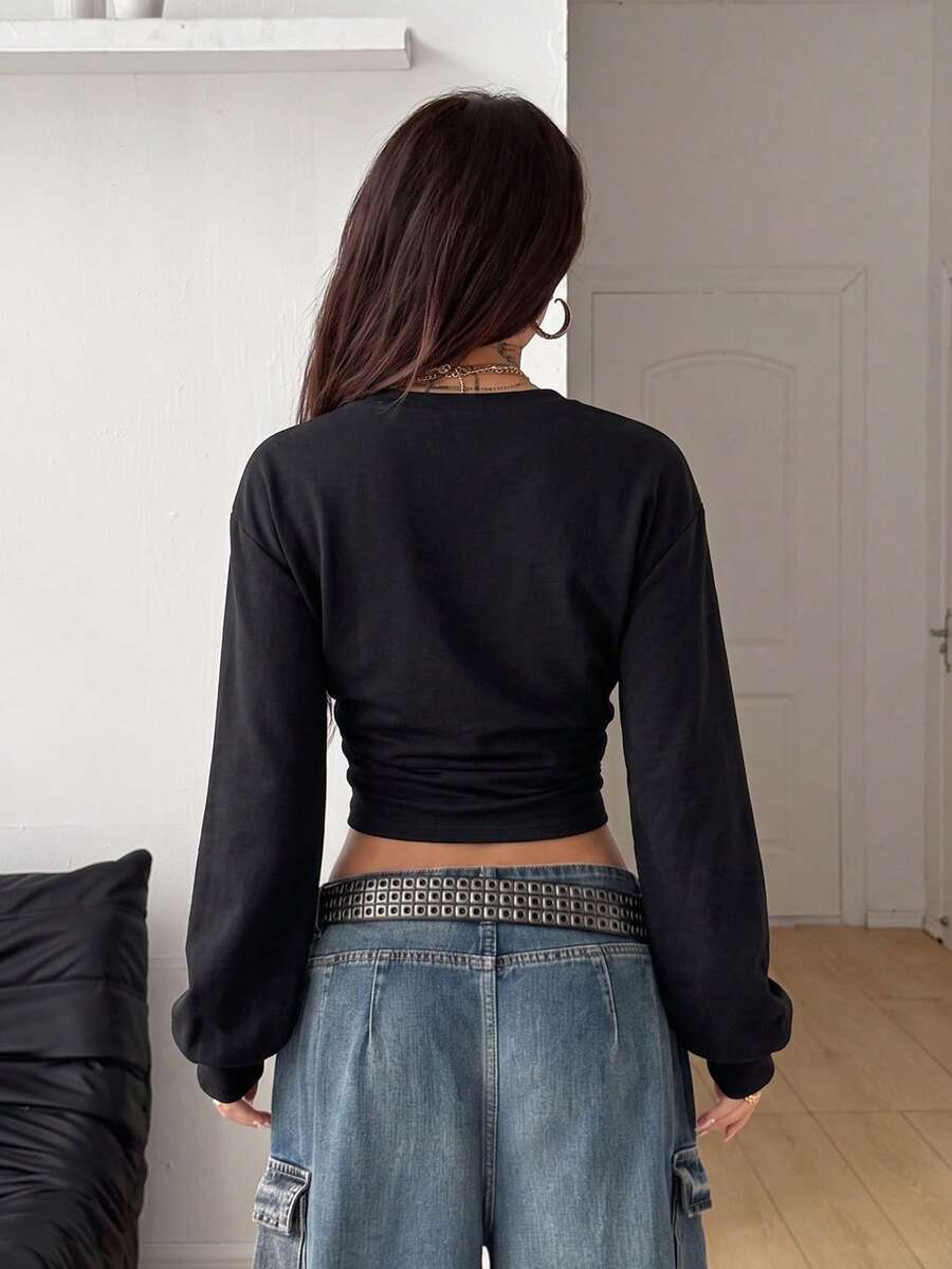 Women's brown waist-cinching sweatshirt featuring a round neck, drop shoulder long sleeves, and rib-knit cuffs.