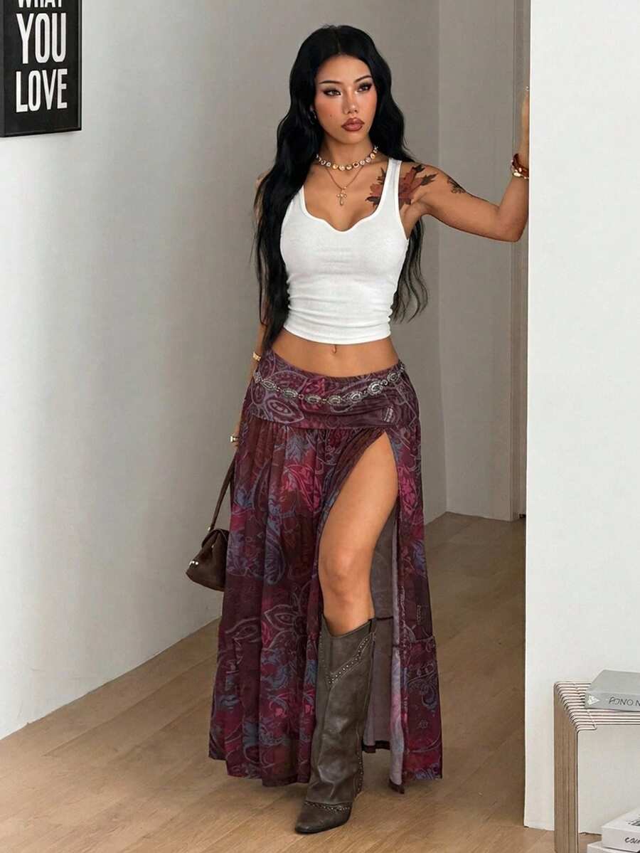 Women's floral split thigh long skirt in textured mesh fabric with a flared silhouette and low waist.