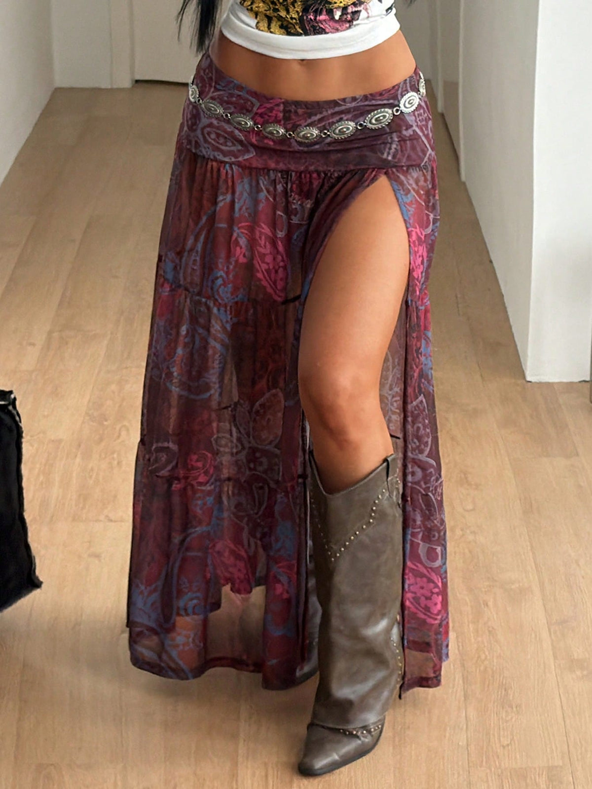 Women's floral split thigh long skirt in textured mesh fabric with a flared silhouette and low waist.