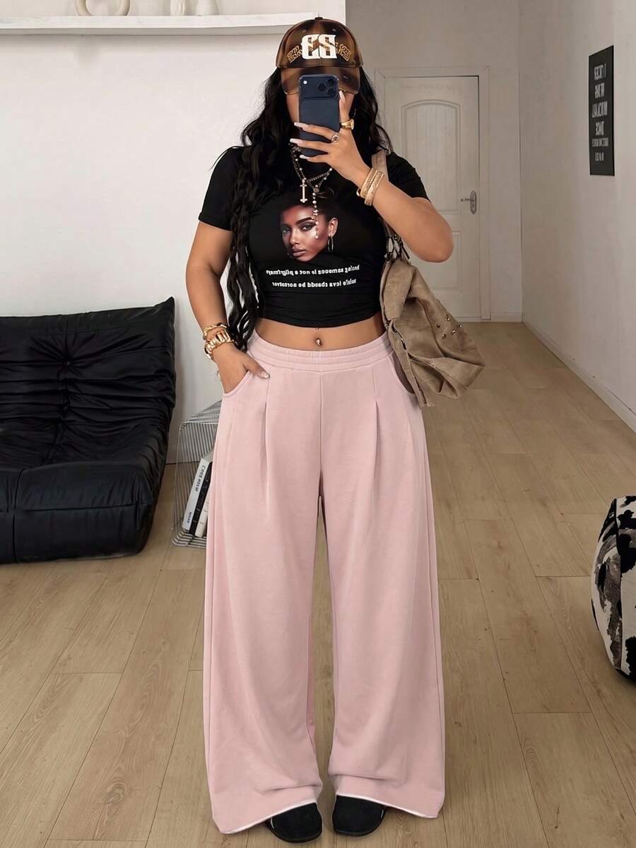 Women's loose wide leg casual sweatpants with an elastic waistband and side pockets