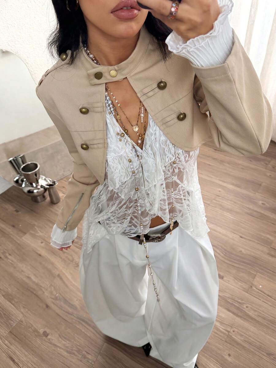 Women's khaki cropped military jacket featuring decorative Napoleon trim, long regular sleeves, tie neck, grommet eyelets, and single-breasted front closure.