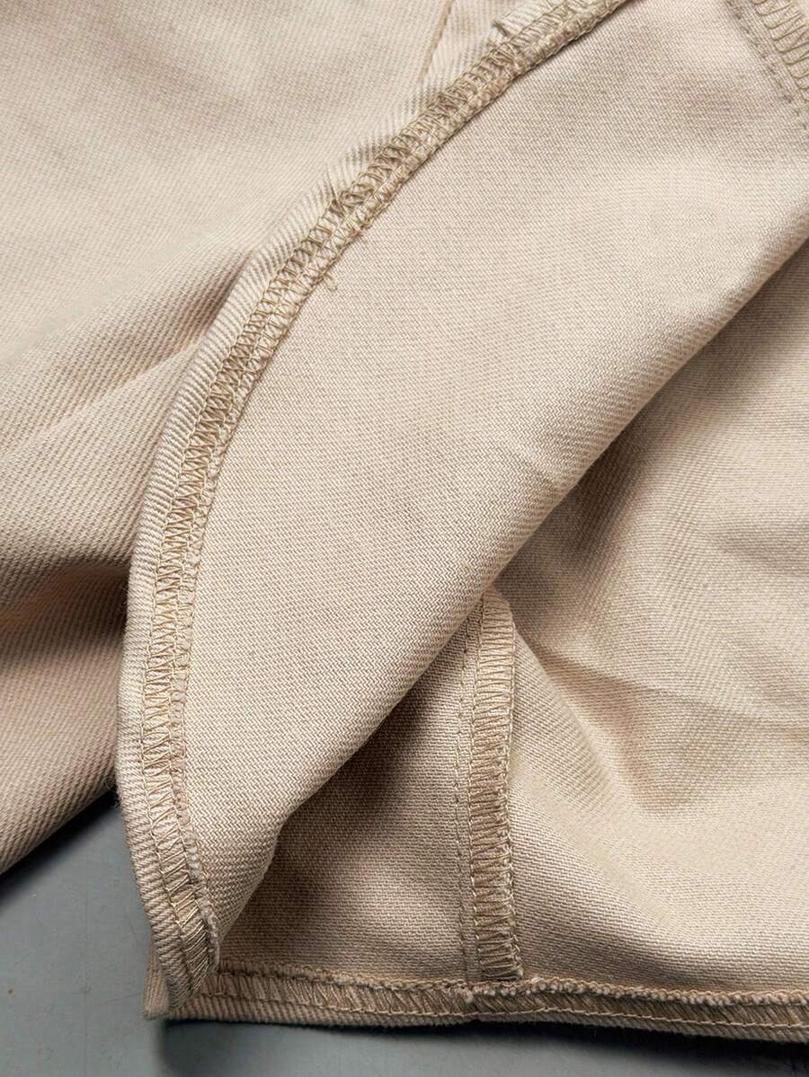 Women's khaki cropped military jacket featuring decorative Napoleon trim, long regular sleeves, tie neck, grommet eyelets, and single-breasted front closure.