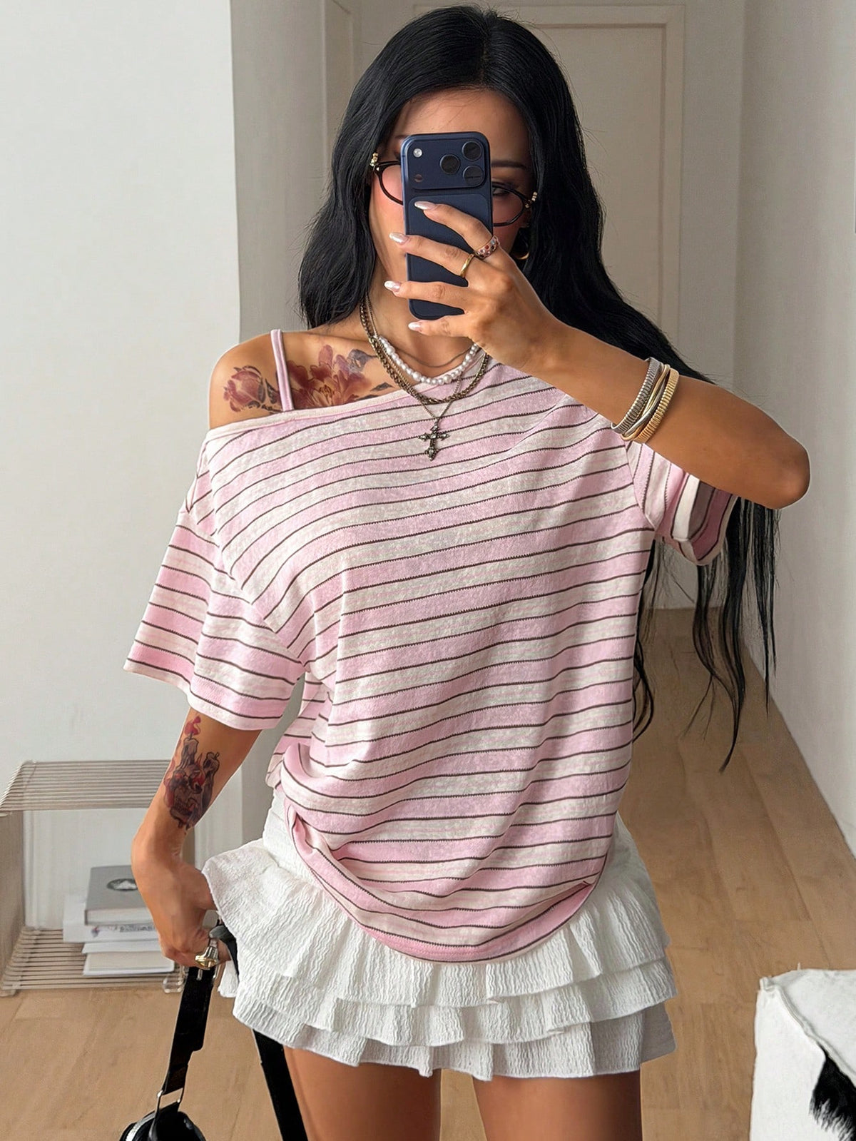 Women's casual loose fit cold shoulder cotton t-shirt with asymmetrical cutout neckline and short sleeves.