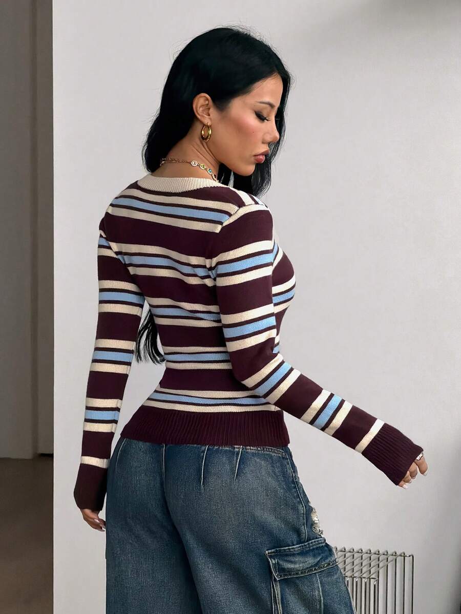 Women's striped long sleeve V-neck cable-knit pullover sweater with ribbed trim.