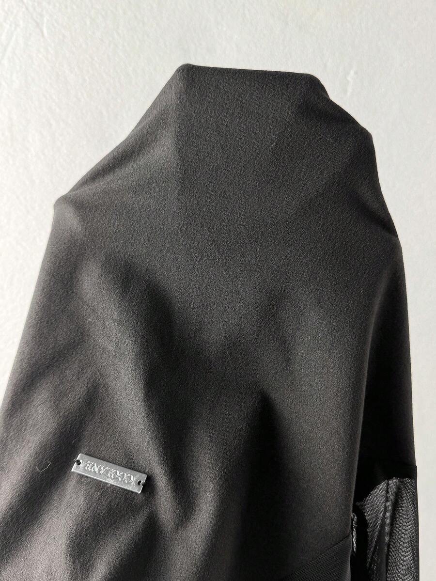 Women's black long sleeve bodysuit with sheer contrast lace raglan sleeves and stand collar.