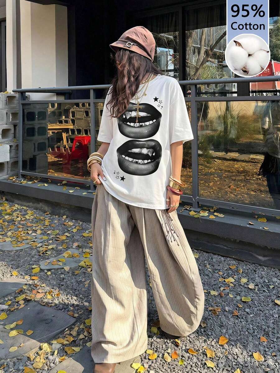 Unisex oversized grey graphic t-shirt featuring drop shoulder half sleeves, a round neckline, and a relaxed loose fit.