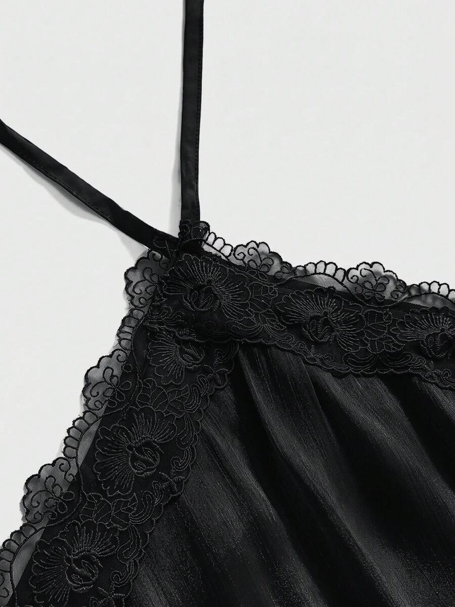 Front and back view of a women's halter neck sleeveless mini dress with contrast lace patchwork, tie knot backless detail, and layered ruffle hem.