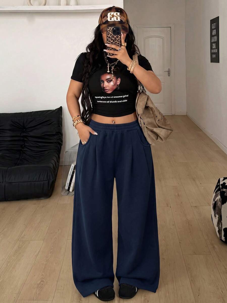 Women's loose wide leg casual sweatpants with an elastic waistband and side pockets