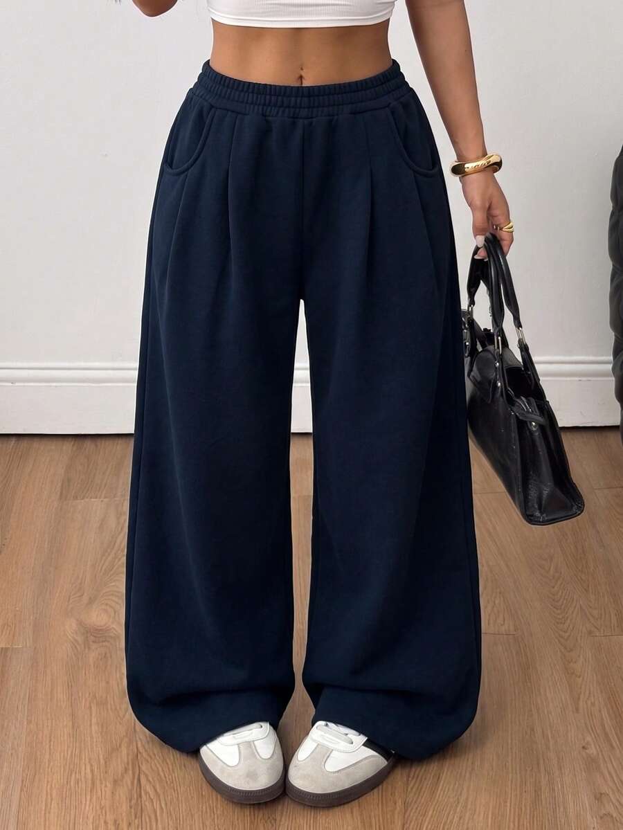 Women's loose wide leg casual sweatpants with an elastic waistband and side pockets