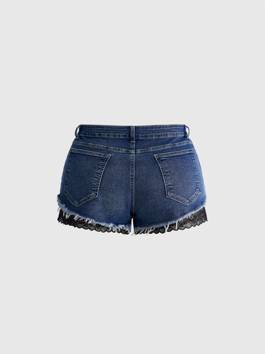 Front view of women's plus size skinny denim shorts featuring lace patchwork detailing, mid-rise waist, button zipper closure, and classic pockets.