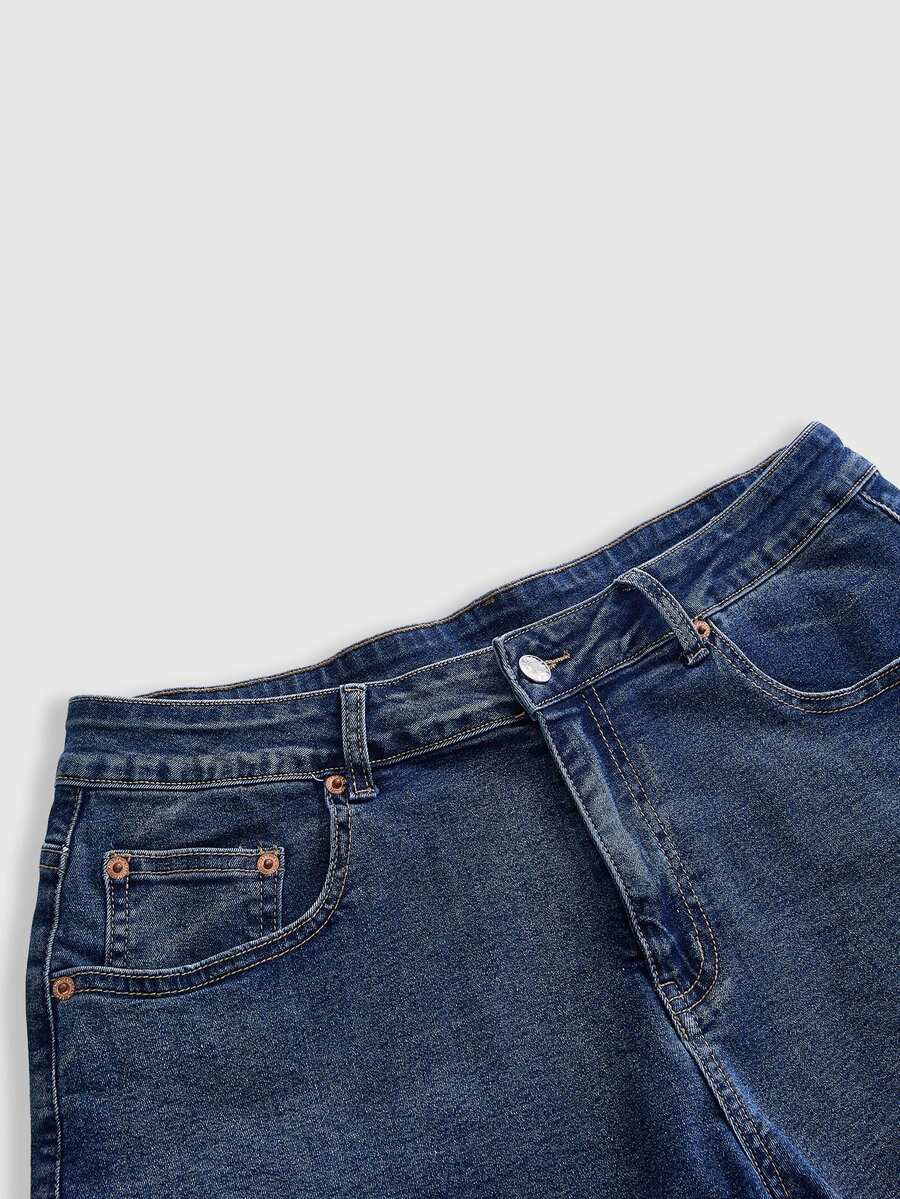Front view of women's plus size skinny denim shorts featuring lace patchwork detailing, mid-rise waist, button zipper closure, and classic pockets.
