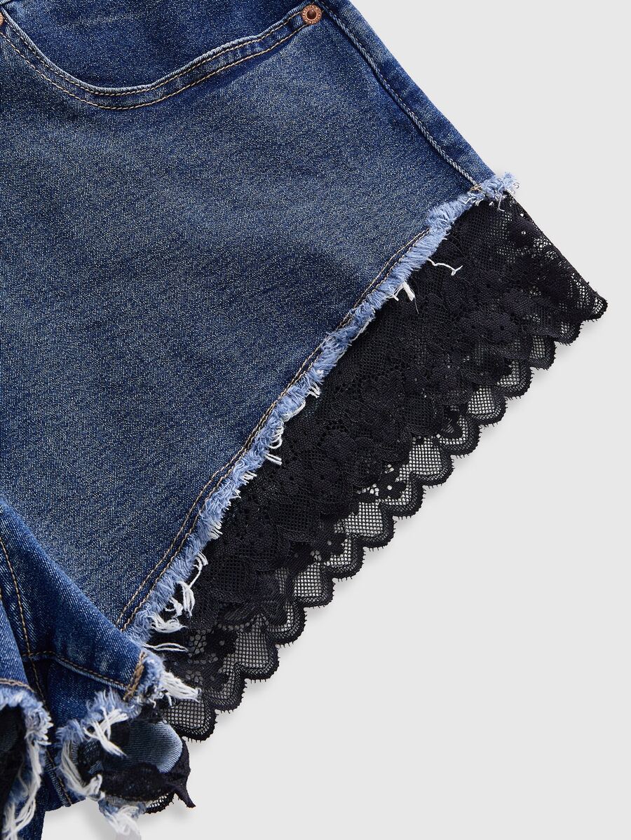 Front view of women's plus size skinny denim shorts featuring lace patchwork detailing, mid-rise waist, button zipper closure, and classic pockets.